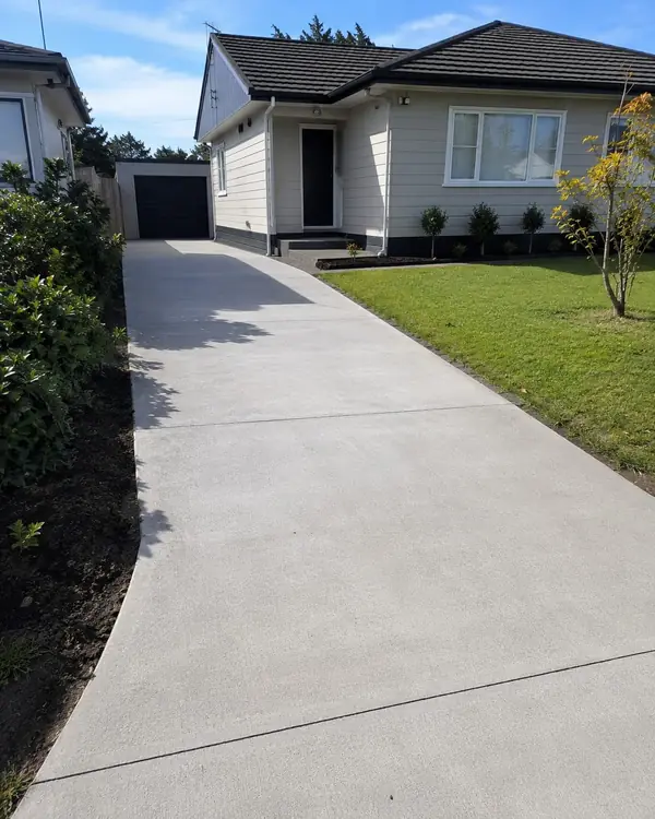 New concrete driveway leading to a double garage in Glenelg