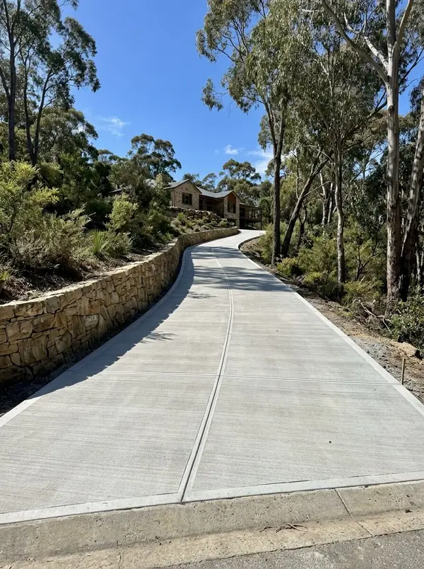 Long sloping concrete driveway climbing to a home in the Adelaide Hills, Stirling