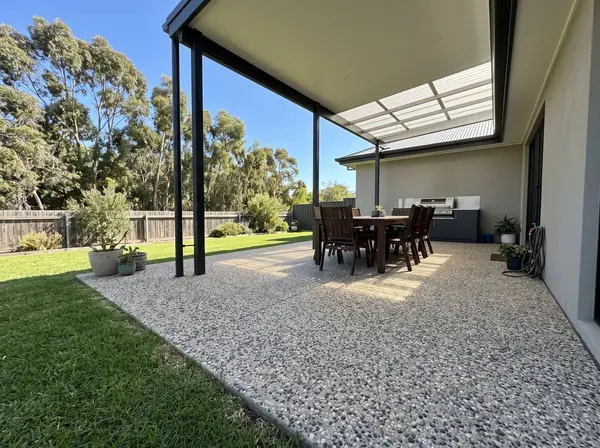 Oatmeal exposed aggregate alfresco under a pergola