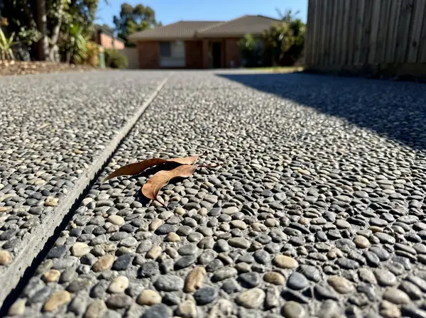 Close up of the stone in a sealed natural grey exposed aggregate finish