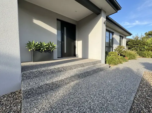 Formed exposed aggregate steps and porch at a front door