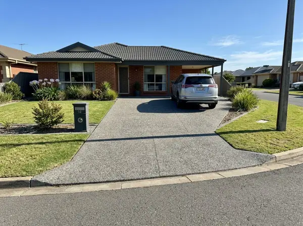Natural grey exposed aggregate double driveway and crossover