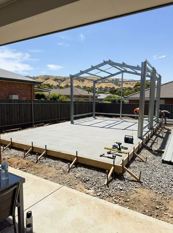 Shed slab with the frame going up, the foothills over the fence, Wynn Vale