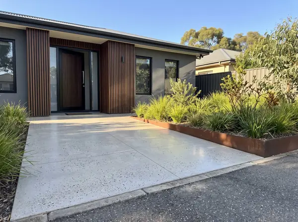 Honed concrete entry courtyard and path at a contemporary Adelaide home