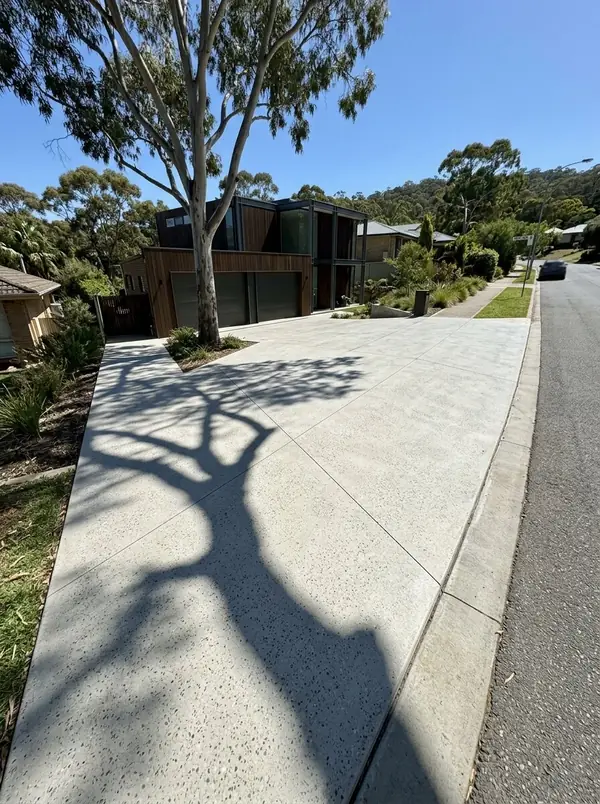 Honed concrete garage apron and side path with a gum tree shadow, Mitcham