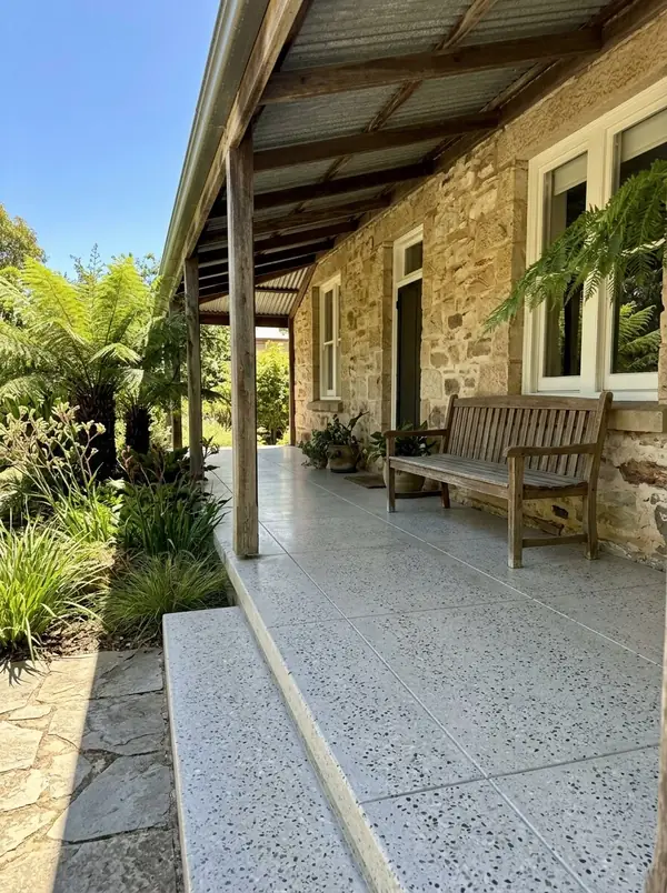 Honed concrete verandah floor at a stone cottage, Stirling