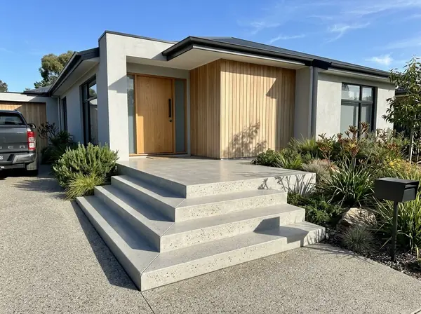 Honed concrete front entry with wide steps at a contemporary home, Adelaide