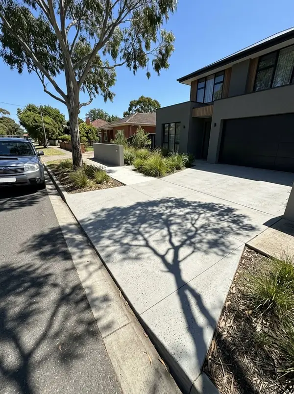 Honed concrete garage apron and side path at a modern home, Mitcham
