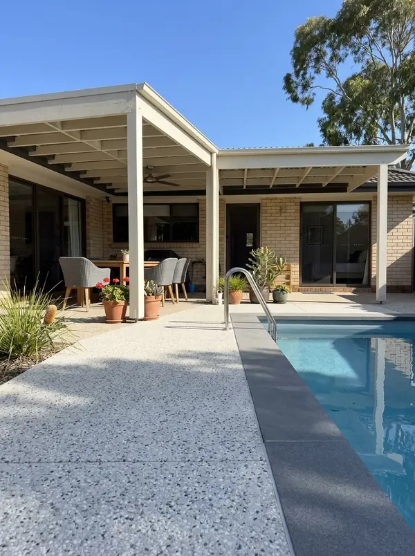 Pale exposed aggregate pool surround and alfresco under a pergola, Mitcham