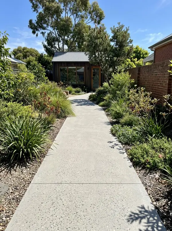 Honed concrete garden walkway through a native garden to a rear studio, Norwood