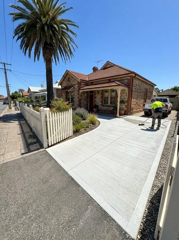 New broom-finished driveway at a 1920s stone and brick cottage, Port Adelaide