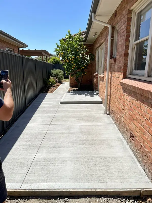 New concrete side path and back landing at a 1950s brick home, Semaphore