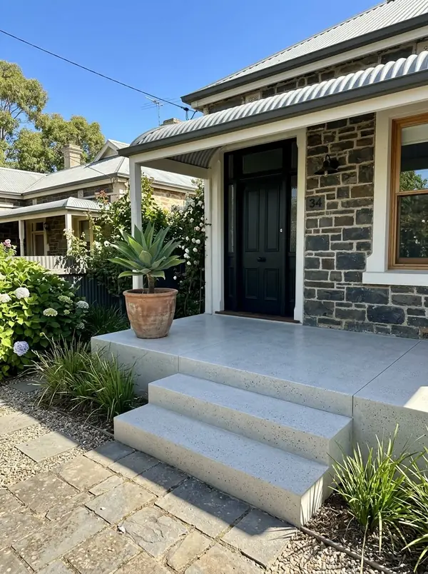 Honed concrete porch and steps at a renovated bluestone cottage, Alberton
