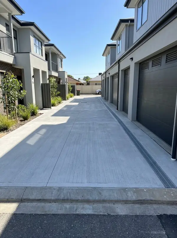 Shared broom-finished driveway between new townhouses, Rosewater