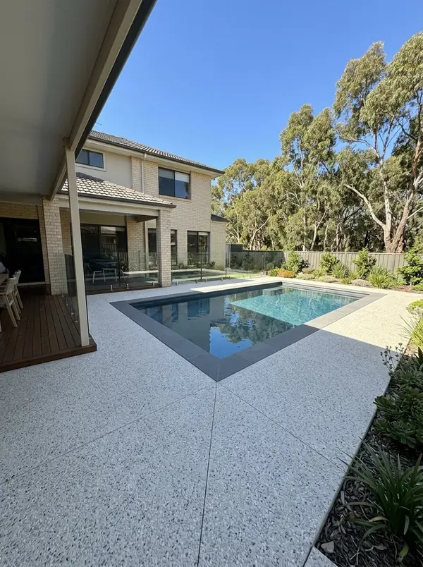 Oatmeal exposed aggregate pool surround and steps, Golden Grove