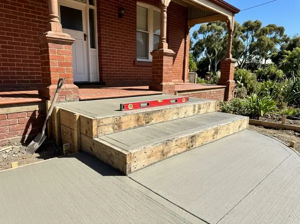 Freshly formed concrete steps with riser boards on