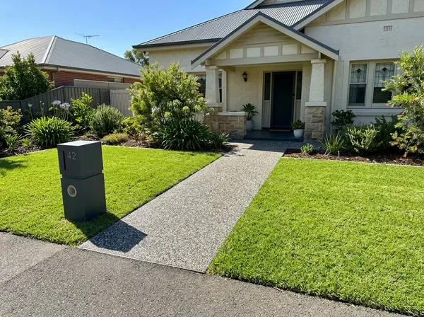 Exposed aggregate front entry path from a footpath to a porch