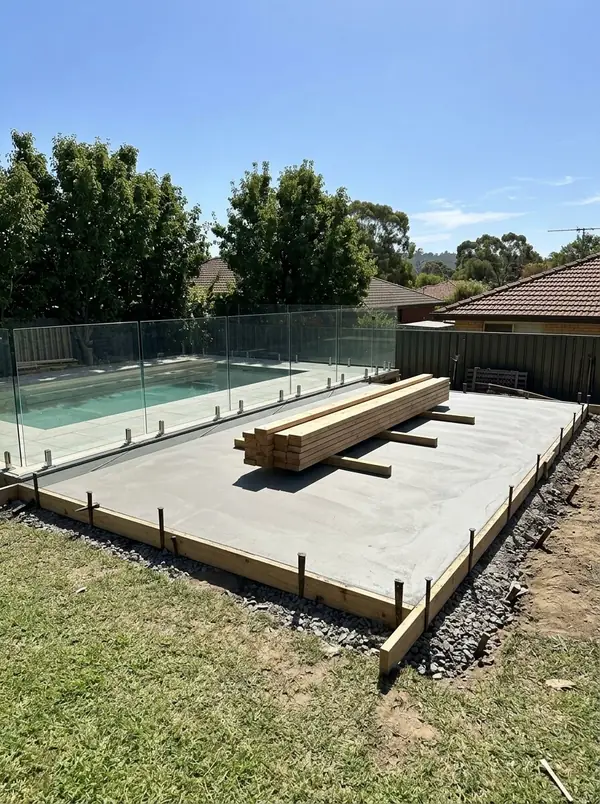 Pool house slab beside a backyard pool, Burnside