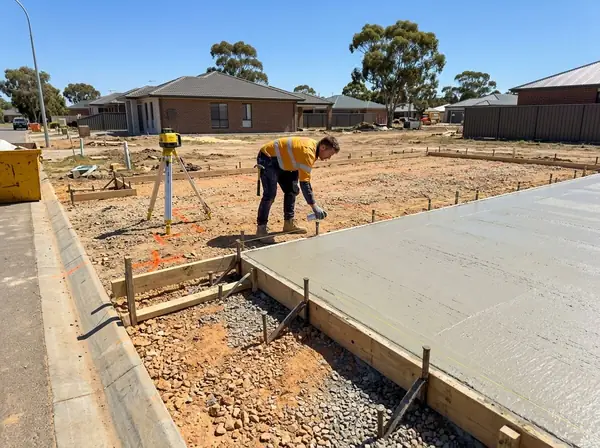 Setting out a slab with string lines and a laser level