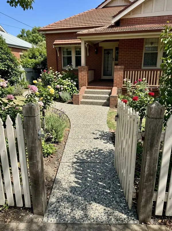 Oatmeal exposed aggregate front path and porch steps at a bungalow, Hyde Park